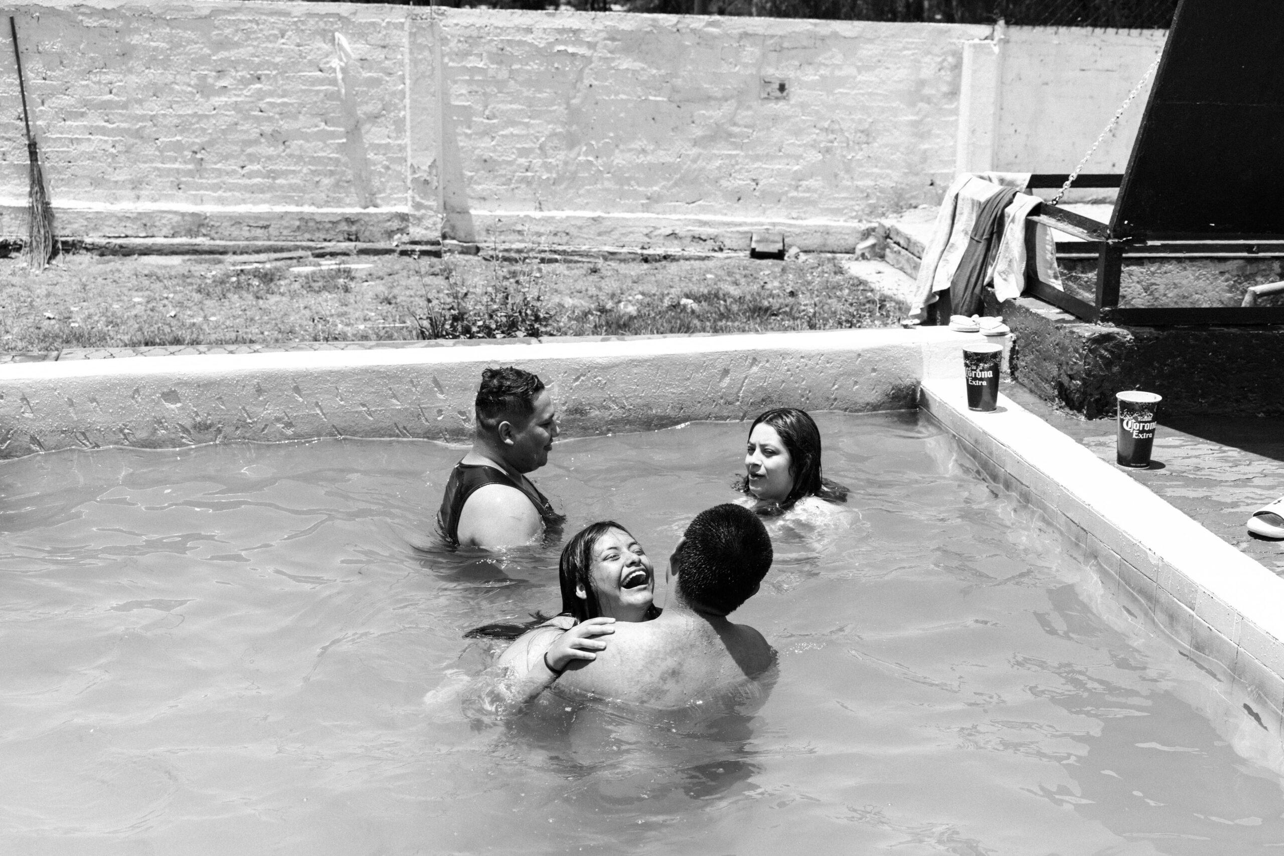 A young woman enjoys the cool water with her friends, May 26, 2024.